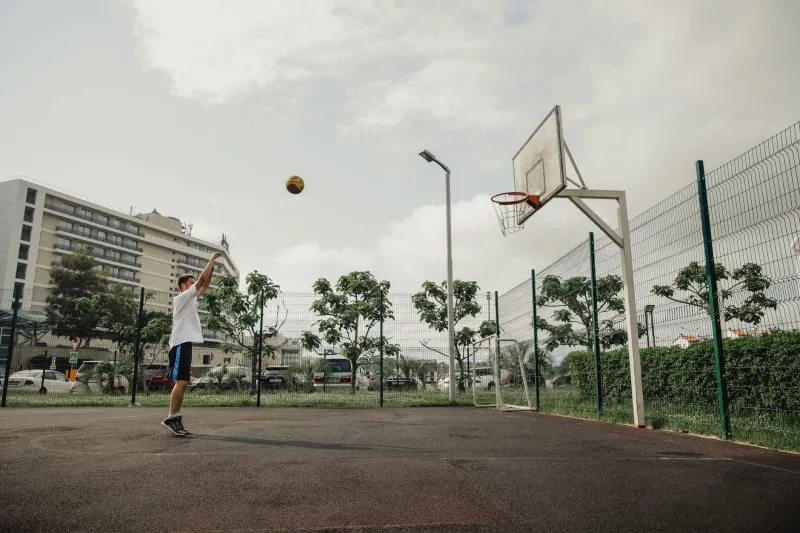 Arc, Angle, and Backspin: The Classical Mechanics Behind the NBA's Most Reliable Shot